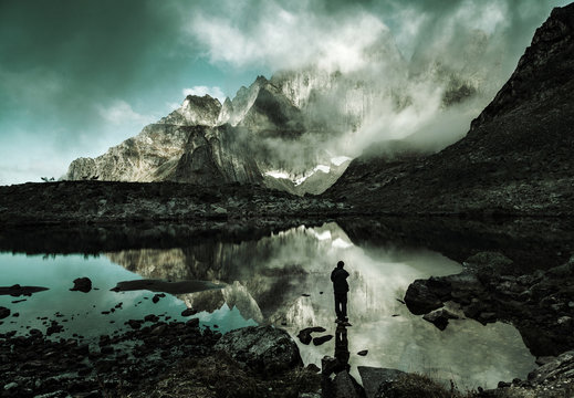 Silhouette Of Man On Mountain Lake