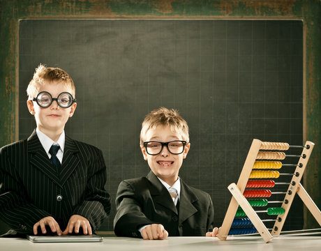 young clever scientist children students with abacus and blackboard