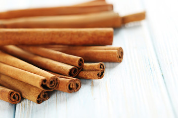Cinnamon on a blue wooden background