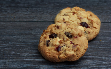White chocolate and cranberries on rustic wooden table