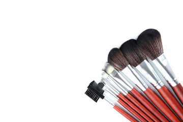 Makeup brushes set on a white background