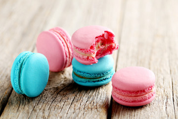 Tasty french macarons on a grey wooden table