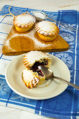 Small confiture pie on the white plate