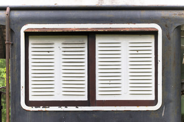 Window of old rusty train.