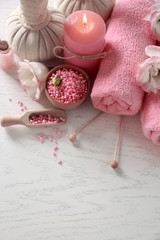 Beautiful composition of spa treatment on a white wooden table