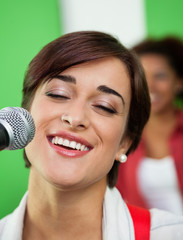 Woman Singing While Closing Eyes