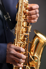 Obraz premium African American jazz musician playing the saxophone, closeup