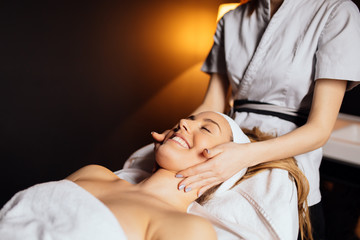 Fototapeta na wymiar Massaging of a beatufil woman