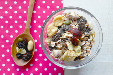 Top view, Granola with dry fruits, nuts and oat in a bowl