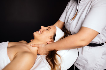 Fototapeta na wymiar Massaging of a beatufil woman