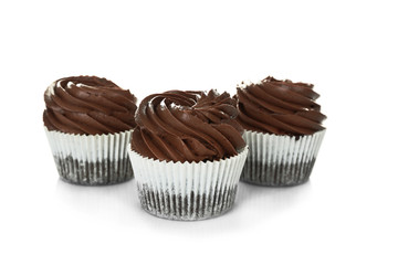 Three chocolate cupcakes, isolated on white