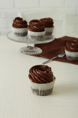 Chocolate cupcakes on light table, close up