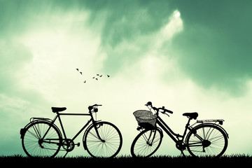 Naklejka premium bicycles at sunset