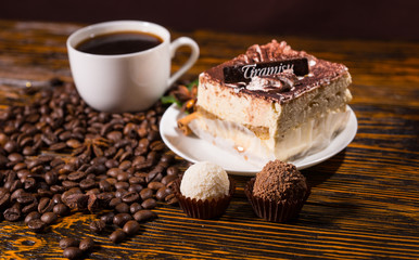 Truffles, Tiramisu and Black Coffee on Wood Table