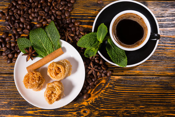 Black Coffee with Gourmet Pastries and Fresh Mint
