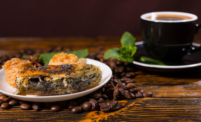 Black Coffee Served with Pastries on Wood Table