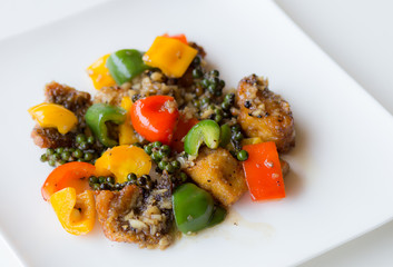Closeup Fried fish with sweet peppers.