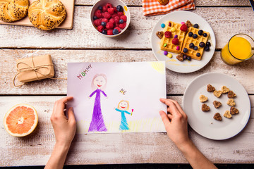 Childs drawing of her mom. Mothers day. Breakfast meal.