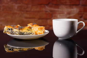Cup of Hot Coffee with Plate of Gourmet Pastries