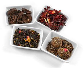 Variety of tea leaves, isolated on white