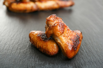 Baked chicken wings on slate plate