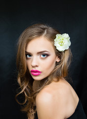 portrait of a girl with pink lips flower head