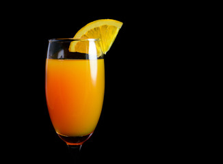 Mimosa cocktail with a slice of orange