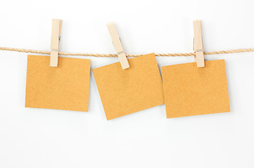 Notice card, brown paper and wood clips