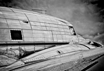 Close up on side and wing of old DC-3 plane