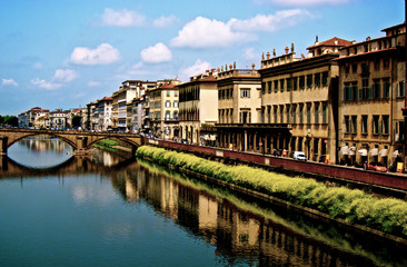 Fototapeta premium Bridge and Buildings Along River in Florence