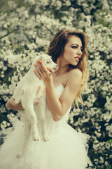 Sensual woman with small goat