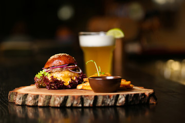 Fresh burger on a wooden board.