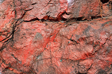 Red rough stone texture closeup background