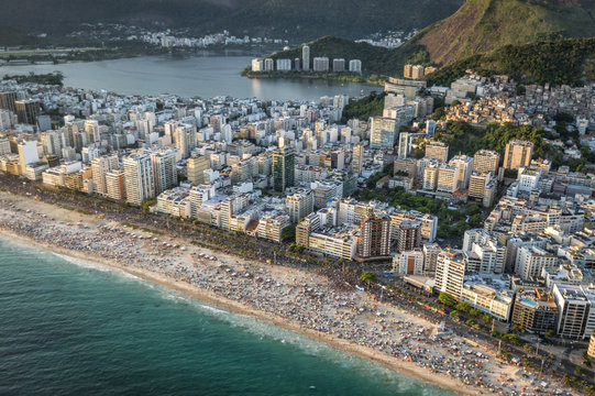 Crowded Beach in Rio de Janeiro at sunset, Brazil