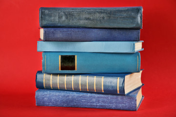 Stack of  books on red background