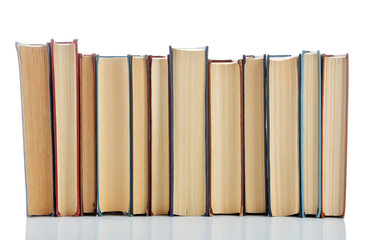 Books positioned in a line isolated on white