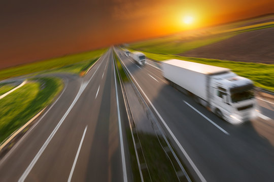 Motion image of new delivery trucks on the highway