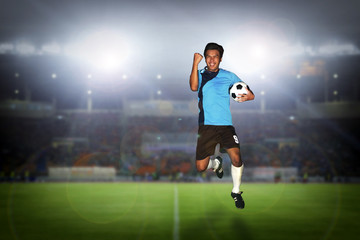 soccer football player young man happiness holding ball jump and