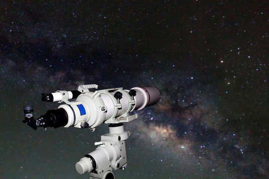 Telescope watching the Milky Way galaxy on dark night at thailan