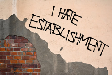 Handwritten graffiti I Hate Establishment sprayed on the wall, anarchist aesthetics. Appeal to...