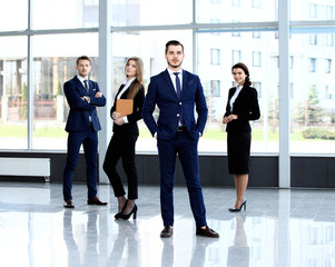Group portrait of a professional business team looking confidently