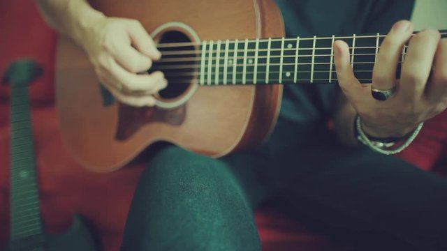 Man playing acoustic guitar