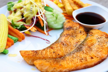 Salmon steak and salad