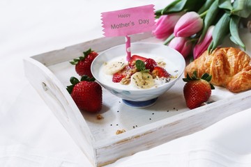 Mother's day breakfast or Brunch / Breakfast yogurt bowl with berries and croissant