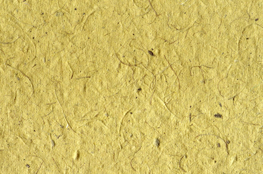 Yellow background - texture of decorative colored paper 