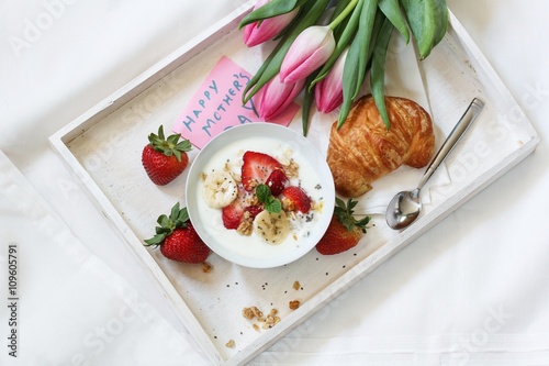 Mother's day breakfast or Brunch / Breakfast yogurt bowl with berries and croissant