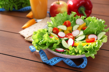 Vegetable salad on wooden table closeup