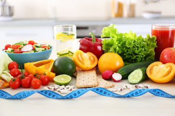 Fresh fruits and vegetables on wooden table closeup