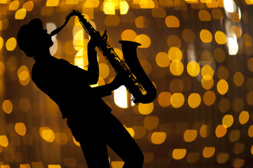 Saxophonist. Woman playing on saxophon