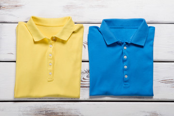 Yellow and blue polo t-shirts.